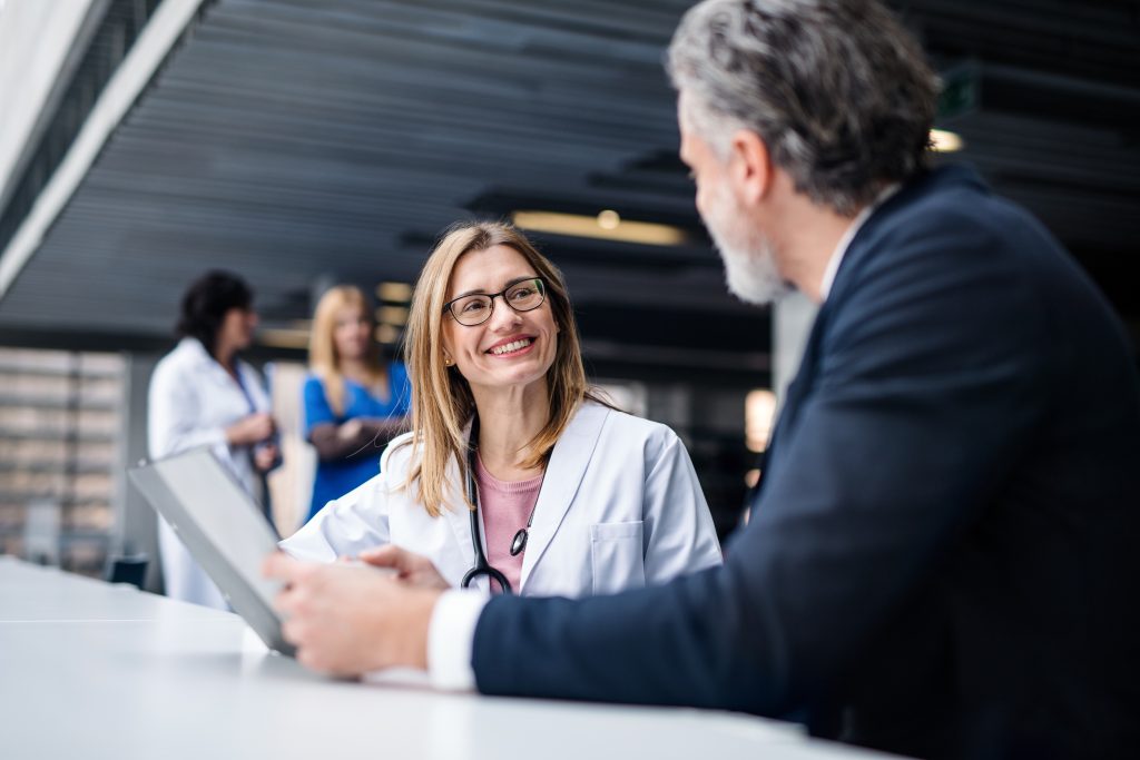 Nurse working with a businessman to set up their practice.